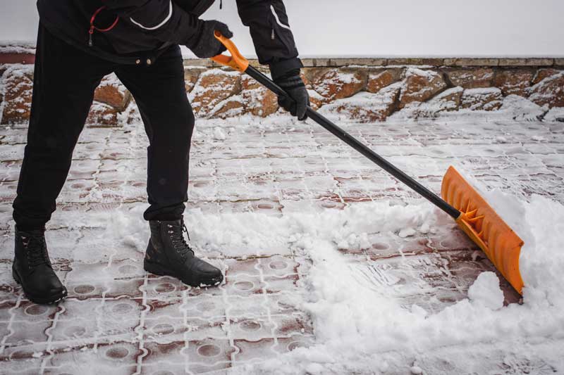 Land a Gig with YesGig, person shoveling a walk after a snowstorm